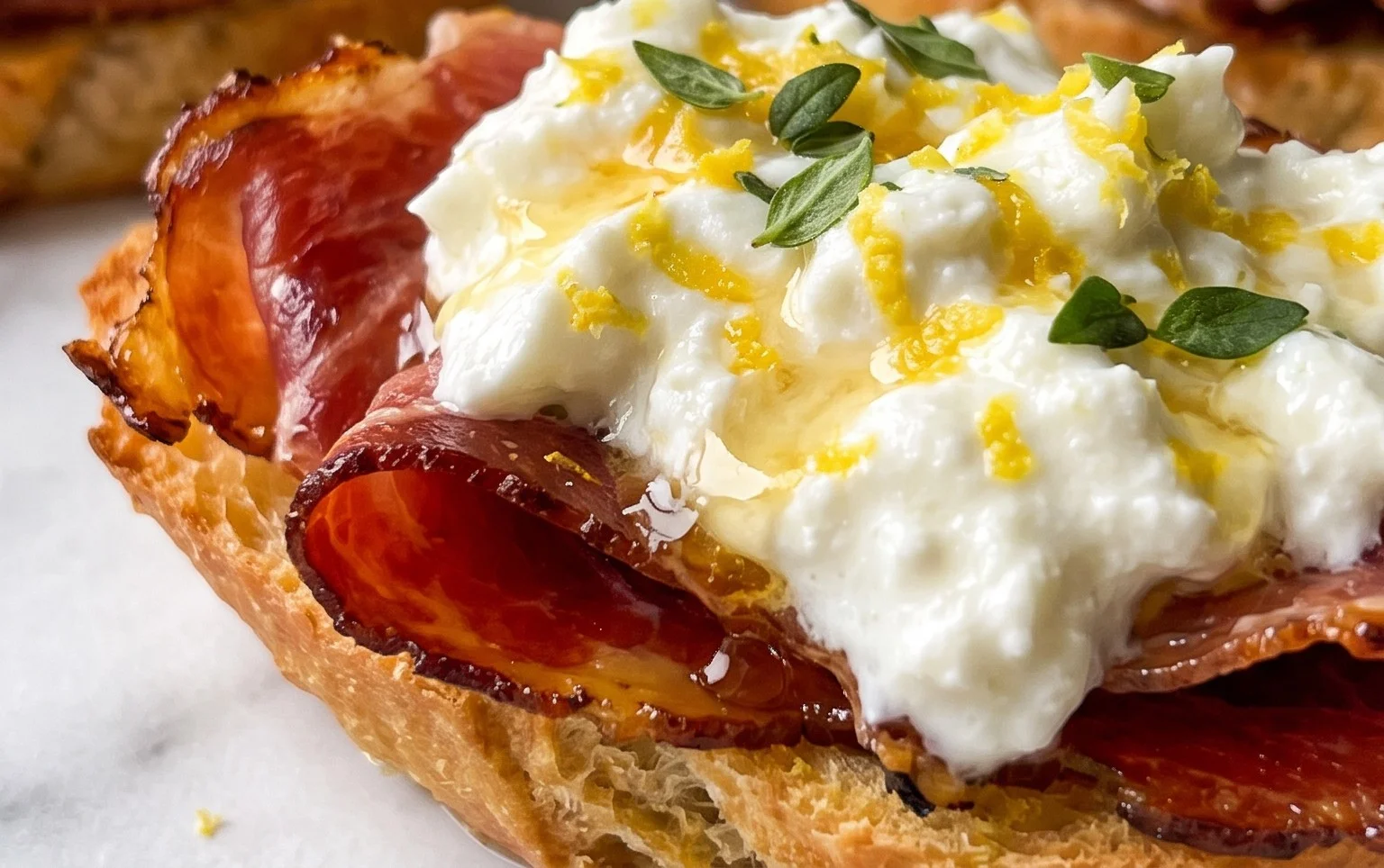 Beef Prosciutto Crostini with Burrata and Lemon Honey Drizzle